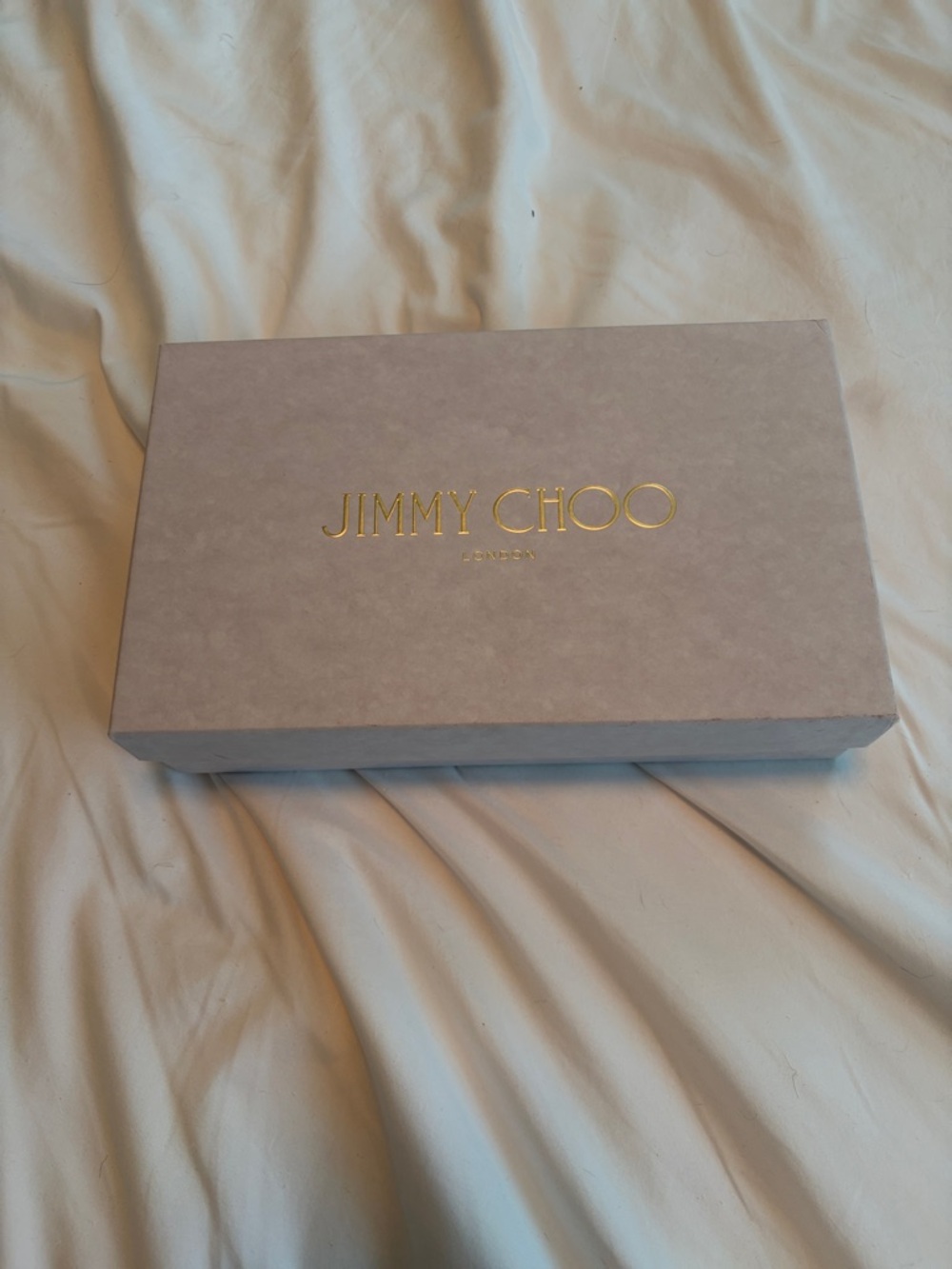 Jimmy Choo brown purse. It is in pristine condition. Never used.